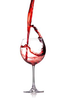 red wine splashing in a glass, isolated on white