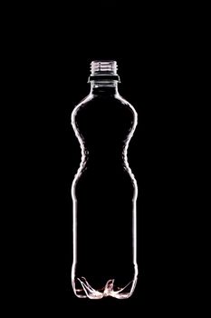 empty water bottle on black - backlit technique