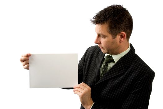 Businessman is holding empty card isolated on white background