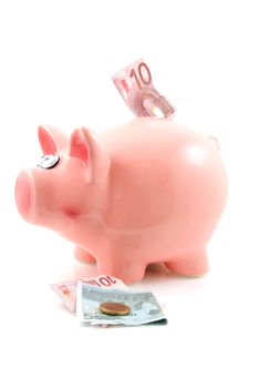 Piggy bank with money isolated on white background