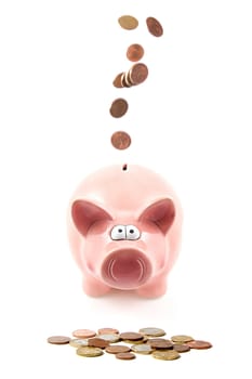Money is falling through piggy bank over white background