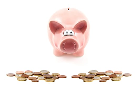 piggy bank and coins isolated on white background