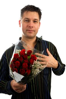 Young man in love is giving red roses, isolated on white background