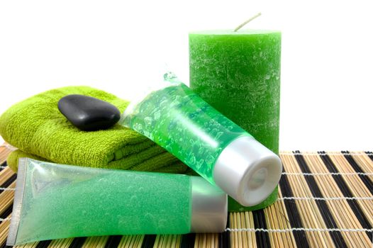 green colored bathroom accessory for spa over white background