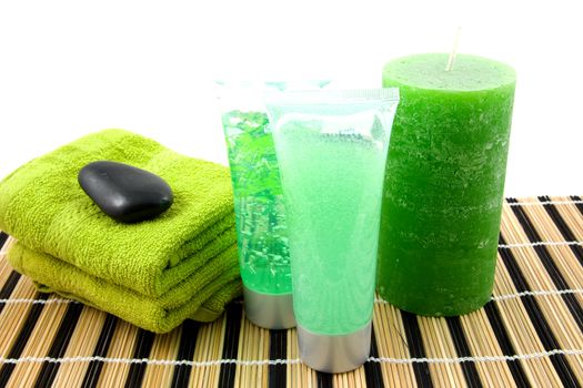 green colored bathroom accessory for spa over white background