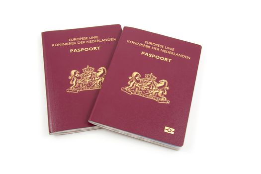Two Dutch passport isolated on white background