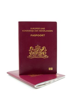 Two Dutch passport isolated on white background