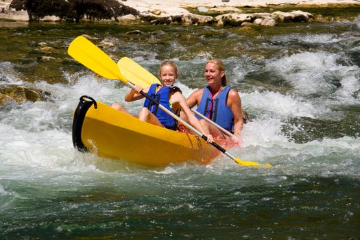 Two people in canoe enjoying holidays and nice weather