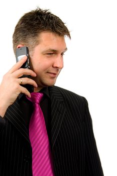 Businessman with pink tie is on the phone isolated on white background