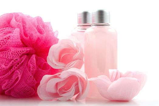 Pink colored bath accessory over white background
