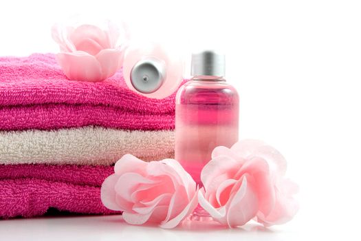 Pink colored bath accessory over white background
