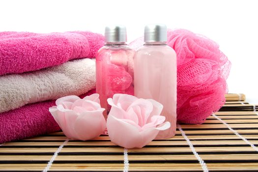 Pink colored bath accessory over white background