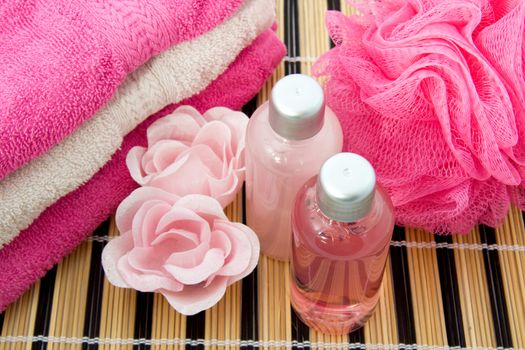 Pink colored bath accessory over white background