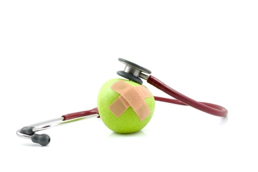 sick apple with patches and stethoscope isolated on white background