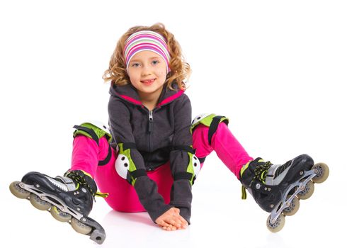 Cute girl in roller skates on a white background