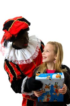 Zwarte piet ( black pete) typical Dutch character part of a traditional event celebrating the birthday of  Sinterklaas in december with young blonde girl over white background