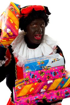 Zwarte piet ( black pete) typical Dutch character part of a traditional event celebrating the birthday of  Sinterklaas in december over white background holding presents