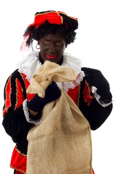 Zwarte piet ( black pete) typical Dutch character part of a traditional event celebrating the birthday of  Sinterklaas in december over white background with bag