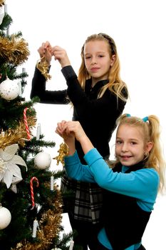 Two girls decoration christmas tree over white background