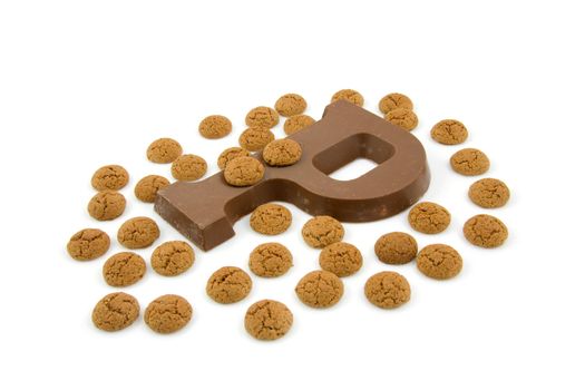 Chocolate letter P and ginger nuts for Sinterklaas, event in the Dutch in december, over white background