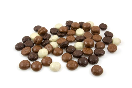 chocolate gingernuts, pepernoten,over white background. Tyical Dutch candy for 5 december.
