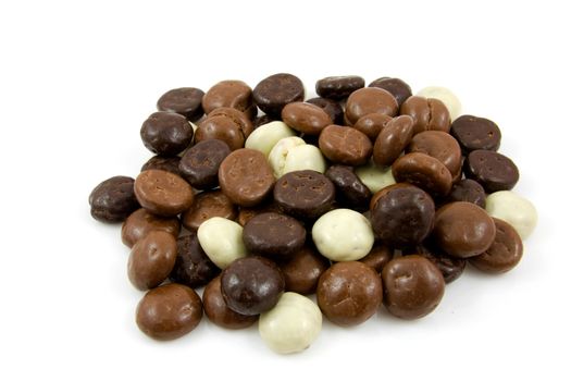 chocolate gingernuts, pepernoten,over white background. Tyical Dutch candy for 5 december.