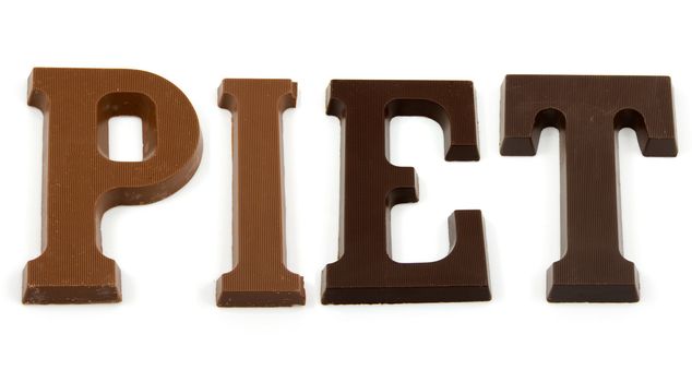 The word "PIET" in chocolate letters isolated on white background, typical Dutch candy for Sinterklaas event in december
