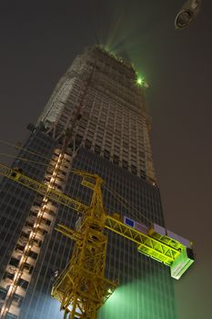 Construction of the Highest Building in Beijing China At Night.  Construction of the the third trade center building in Beijing, October 2007