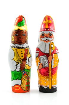 Chocolate black pete ( zwarte piet) and sinterklaas ( santa claus), candy for a traditional event in the Netherlands, over white background