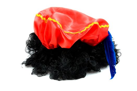 red hat with blue feather and black hair of Zwarte Piet, typical Dutch event in december