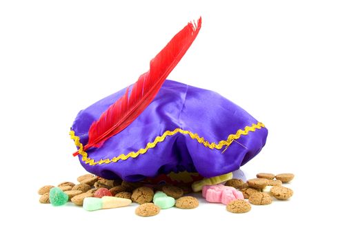 purple hat with red feather of Zwarte Piet and ginger nuts, typical Dutch event in december