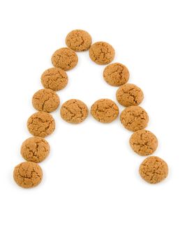 Ginger nuts, pepernoten, in the shape of letter A isolated on white background. Typical Dutch candy for Sinterklaas event in december.