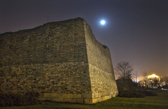 City Wall Park with Moon Stars at Night Dongguan Men in Background Beijing China

Resubmit--In response to comments from reviewer have further processed image to reduce noise, sharpen focus and adjust lighting.