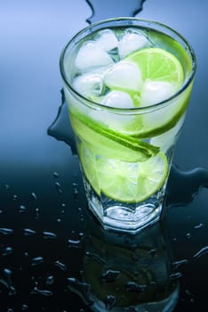 cold fresh  ice lemonade  on  black background with  water drops