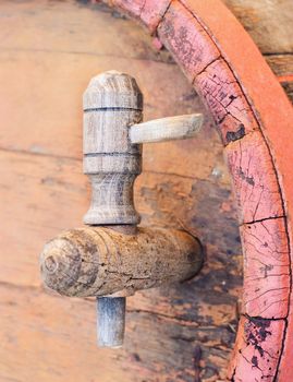 Big wood barrel with faucet in old wines cellar