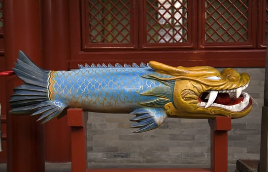 Wooden Dragon Fish Bell Fayuan Buddhist Temple Beijing China This wooden bell is used to call Buddhist monks to prayer.

Resubmit--In response to comments from reviewer have further processed image to reduce noise, sharpen focus and adjust lighting.
