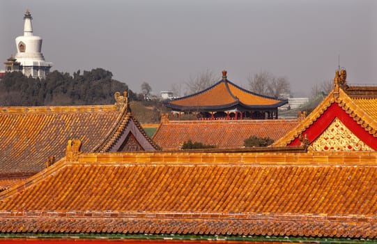 Beihai Stupa Forbidden City Yellow Roofs Gugong Decorations Emperor's Palace Built in the 1400s in the Ming Dynasty

Resubmit--In response to comments from reviewer have further processed image to reduce noise, sharpen focus and adjust lighting.