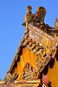 Roof Figurines "Bitter End" Yellow Roofs Gugong, Forbidden City Beijing China
Roof Figures Decorations Emperor's Palace Built in the 1400s in the Ming Dynasty

Resubmit--In response to comments from reviewer have further processed image to reduce noise, sharpen focus and adjust lighting.
