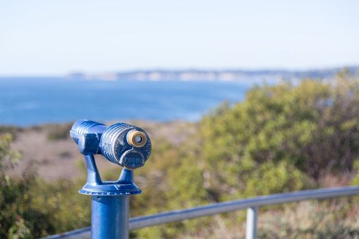 Blue painted telescope on California coast near Malibu