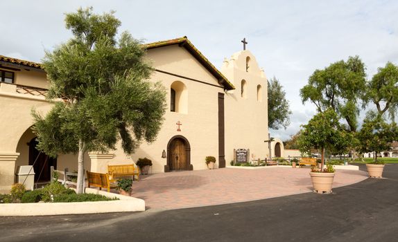 Mission Santa Ines in California exterior on sunny day with clouds