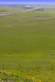 Scenic California Interstate I-5 Along Green Pastures and Farmland.