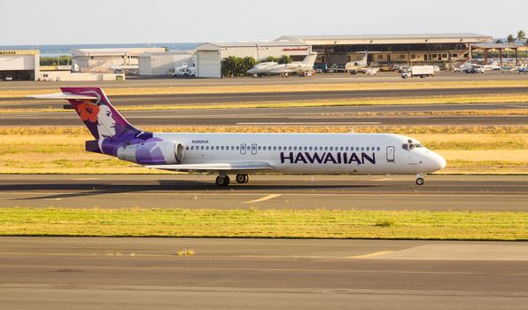 Honolulu, HI - 23 JANUARY: Hawaiian Airline Boeing 717 at Honolulu International Airport on 23 January 2013. Hawaiian Airlines is largest airline in Hawaii.