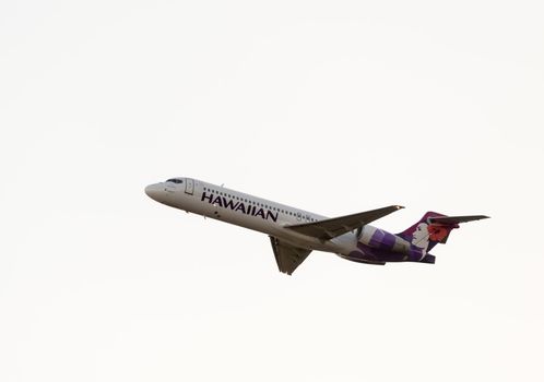 Honolulu, HI - 23 JANUARY: Hawaiian Airline Boeing 717 taking off from Honolulu International Airport on 23 January 2013. Hawaiian Airlines is largest airline in Hawaii.