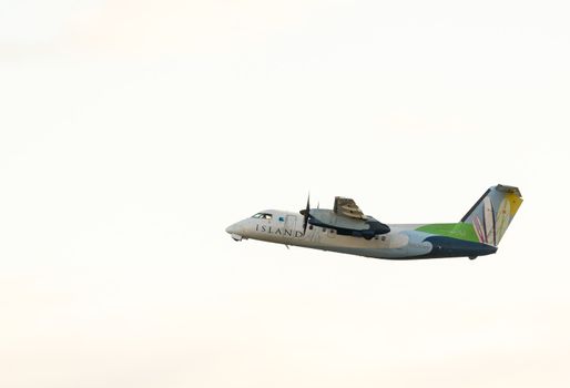 Honolulu, HI - 23 JANUARY: Island Air Dash 8 taking off from Honolulu International Airport on 23 January 2013. The airline has two of these planes.