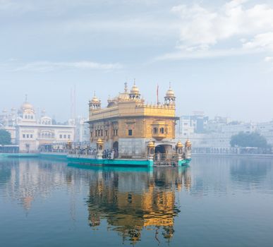 Sikh gurdwara Golden Temple (Harmandir Sahib) in morning fog. Amritsar, Punjab, India