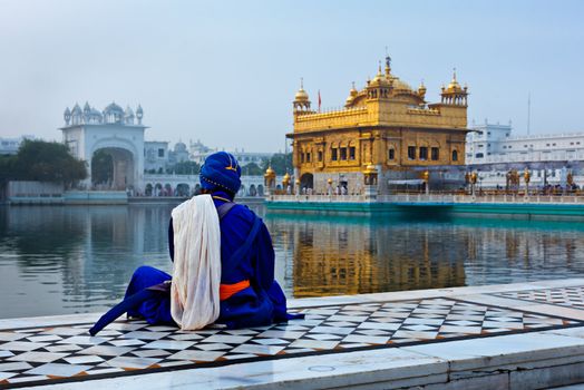 Unidentifiable Seekh Nihang warrior meditating at Sikh temple Harmandir Sahib. Amritsar, India