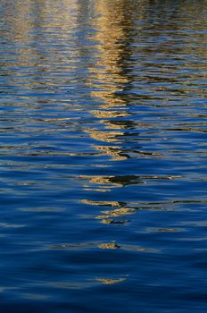 Reflection of church tower in the sea water