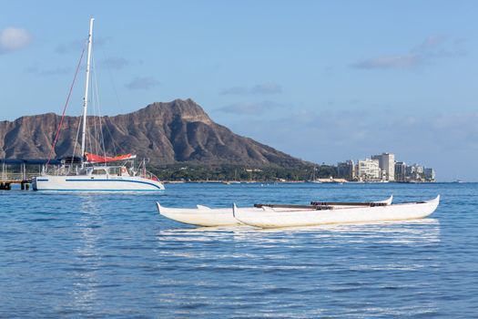 Boat docked in front of Diamond Head and Waikiki Beach area of Oahu in Hawaii