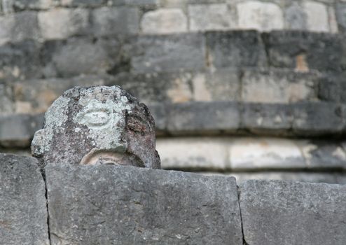 A stone head sculpture found at Chichen Itza (Mayan ruins) in Mexico.  
