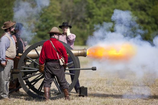 Battlefield, Missouri, USA - August 11, 2012: Civil war re-enactors fire off a cannon at Wilson's Creek National Battlefield Park in Battlefield, MO. Wilson's Creek was the first major Civil War battle fought west of the Mississippi River, and the scene of the death of general Nathaniel Lyon.